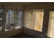Bright sunroom with multiple windows and blinds, offering a view of the backyard at 843 Fairway Dr # 44, Kannapolis, NC 28081