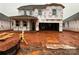 New construction home featuring a covered entry and attached two-car garage in an active construction zone at 1016 Farm Branch Ct, Indian Trail, NC 28079