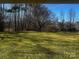 Green lawn surrounded by beautiful trees at 1017 21St Ne Ave, Hickory, NC 28601