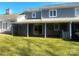 Back of home view showcasing a covered patio with lawn at 1017 21St Ne Ave, Hickory, NC 28601