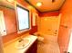 Bathroom with linoleum floors, a toilet, a cabinet, and a bathtub-shower combination at 1017 21St Ne Ave, Hickory, NC 28601