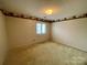 Plain bedroom with neutral carpet, window, and border on the ceiling at 1017 21St Ne Ave, Hickory, NC 28601