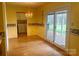 Bright dining area with door to patio and view of laundry room at 1017 21St Ne Ave, Hickory, NC 28601