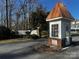 Neighborhood entrance with guardhouse and stone wall under a bright blue sky at 1017 21St Ne Ave, Hickory, NC 28601