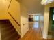 The entryway features wood floors, white walls, a wooden staircase, and a view into the living room at 1017 21St Ne Ave, Hickory, NC 28601