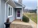 Inviting home entrance with a white door, well-manicured bushes, and brick-lined walkway at 1017 21St Ne Ave, Hickory, NC 28601