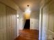 Bright foyer with hardwood floors, a decorative light fixture, and a staircase at 1017 21St Ne Ave, Hickory, NC 28601