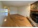 Open living room with hardwood floors and stone fireplace at 1017 21St Ne Ave, Hickory, NC 28601