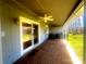 Covered patio with brick flooring and ceiling fan at 1017 21St Ne Ave, Hickory, NC 28601