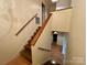 Staircase with wooden handrail, leading to the upper level at 1017 21St Ne Ave, Hickory, NC 28601