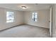 Spacious bedroom featuring carpet and multiple windows at 105 Valley Ave, Clover, SC 29710