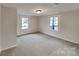 Well-lit bedroom with neutral walls and carpet flooring at 105 Valley Ave, Clover, SC 29710