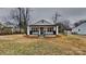 Charming white cottage with a front porch and well-maintained lawn at 105 Valley Ave, Clover, SC 29710