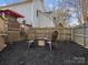 Landscaped backyard with fire pit and mulch at 10513 Danesway Ln, Cornelius, NC 28031