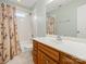 Clean bathroom with tub, shower, and updated vanity at 10513 Danesway Ln, Cornelius, NC 28031