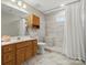 Updated bathroom with a large walk-in shower and modern tile at 10513 Danesway Ln, Cornelius, NC 28031