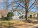 Two-story house with light blue siding, attached garage, and mature tree in the front yard at 10513 Danesway Ln, Cornelius, NC 28031