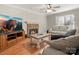 Living room with hardwood floors, fireplace, and comfortable seating at 10513 Danesway Ln, Cornelius, NC 28031