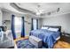 Spacious bedroom with a king-size bed and blue bedding at 1110 Kirkland Ct, Concord, NC 28025