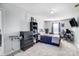 Spacious bedroom featuring a double bed, desk, and built-in shelving at 1110 Kirkland Ct, Concord, NC 28025