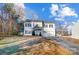 Two-story house with gray siding, attached garage, and a well-manicured lawn at 1110 Kirkland Ct, Concord, NC 28025