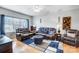 Living room with leather furniture, hardwood floors, and a ceiling fan at 1110 Kirkland Ct, Concord, NC 28025