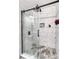 Large walk-in shower with marble tile and glass door at 1110 Kirkland Ct, Concord, NC 28025