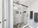 Large walk-in shower with marble tile and glass door at 1110 Kirkland Ct, Concord, NC 28025