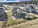 Aerial view of a home with a fenced backyard, patio with porch swing, and a shed in a residential neighborhood at 1169 Hollis Sw Cir, Concord, NC 28025