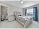 This bedroom has carpet flooring, a ceiling light and a bath right off the room at 1169 Hollis Sw Cir, Concord, NC 28025