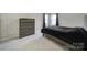 This bedroom has a dark colored bed set and carpet flooring at 1169 Hollis Sw Cir, Concord, NC 28025