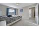 This cozy bedroom features ample natural light and cool-toned walls and decor at 1169 Hollis Sw Cir, Concord, NC 28025