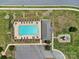 Aerial view of community pool with playground and parking lot at 1169 Hollis Sw Cir, Concord, NC 28025