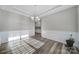 Dining room with tray ceiling, decorative molding, chandelier, and lots of natural light at 1169 Hollis Sw Cir, Concord, NC 28025