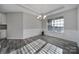 Bright dining room featuring decorative molding, stylish chandelier, and plenty of space at 1169 Hollis Sw Cir, Concord, NC 28025