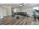 Open-concept living room with hardwood floors, stylish furnishings, and lots of natural light at 1169 Hollis Sw Cir, Concord, NC 28025