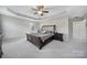 Bright primary bedroom with a trey ceiling, ensuite bathroom, and a walk in closet at 1169 Hollis Sw Cir, Concord, NC 28025