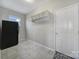 Utility mud room with black refrigerator, tiled floors, and closet hooks for added convenience at 1169 Hollis Sw Cir, Concord, NC 28025