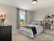 Bright bedroom with a queen-size bed and plenty of natural light at 118 Ryan Ln # 7139, Mooresville, NC 28115