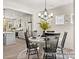 Bright dining room with white table, black chairs, and a chandelier at 118 Ryan Ln # 7139, Mooresville, NC 28115