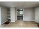 View of additional room with shelving and a gray tiled floor; can be used for a dining area at 1404 Linwood Rd, Gastonia, NC 28052