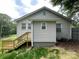 Rear exterior featuring new wooden deck and AC unit at 1404 Linwood Rd, Gastonia, NC 28052