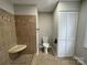 Bathroom featuring tiled shower stall and a toilet with a storage closet behind at 1404 Linwood Rd, Gastonia, NC 28052