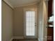 Entryway with door and blind insert and view into kitchen at 1404 Linwood Rd, Gastonia, NC 28052
