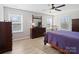 Bedroom with natural light features hardwood flooring, ceiling fan, and dresser at 14106 Magnolia Walk Dr, Huntersville, NC 28078