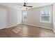 Empty bedroom features two windows, wood floors and neutral paint at 14106 Magnolia Walk Dr, Huntersville, NC 28078