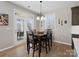 Cozy dining area with a table, chairs, and a view of the outdoor patio through glass doors at 14106 Magnolia Walk Dr, Huntersville, NC 28078