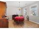 Charming dining room with a round table, wood floors, and natural light at 14106 Magnolia Walk Dr, Huntersville, NC 28078