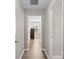 Hallway view looking into bedroom, showing hardwood flooring and neutral paint at 14106 Magnolia Walk Dr, Huntersville, NC 28078