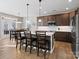 Spacious kitchen featuring a center island with bar seating, stainless steel appliances, and stylish cabinetry at 14106 Magnolia Walk Dr, Huntersville, NC 28078